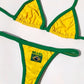 Yellow and green Brasil thong bikini set laid flat on white
