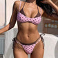 Yellow polka dot triangle bikini with light blue binding, adjustable straps and tie side brief