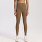 Ankle-length high-waisted yoga leggings in a matte nylon spandex knit on a model