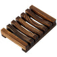 Dark charred pine wood slatted soap rack with side rails on a white background