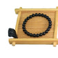 Rose quartz tiger eye bracelet shown on a hand for size and bead scale