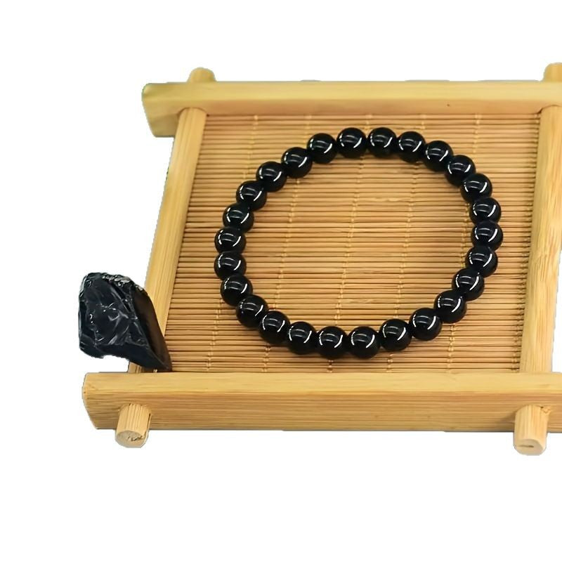 Rose quartz tiger eye bracelet shown on a hand for size and bead scale