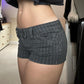 Side and back view of the pinstripe denim shorts showing the shaped back patch pockets