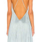 Side view of the sleeveless dress showing the angled hem falling longer on one leg