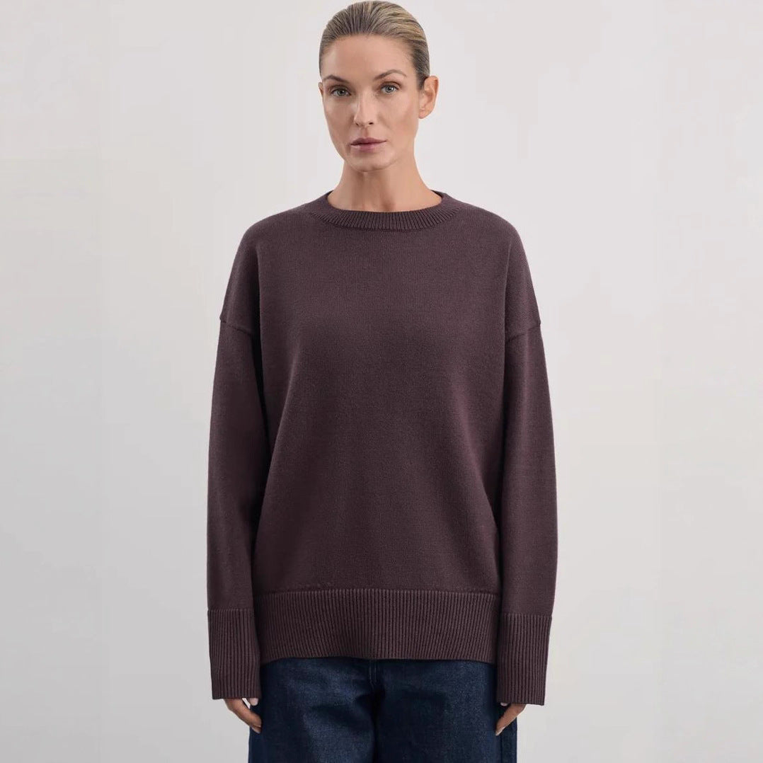 Side angle of the relaxed-fit knit pullover sweater showing sleeve drape