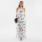 Tiered ruffle layers of the chiffon maxi falling to the floor