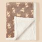 Detail of folded bound edge trim on the teddy print flannel blanket