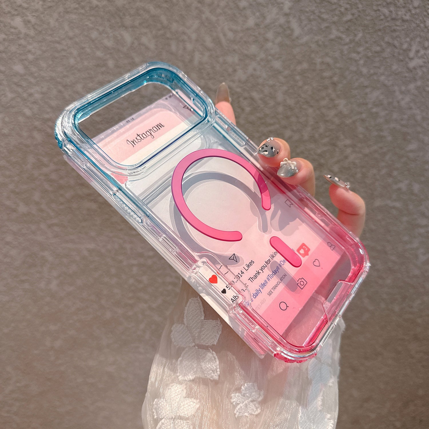 Pink gradient clear case on a phone, raised camera shelf and coloured back ring in view