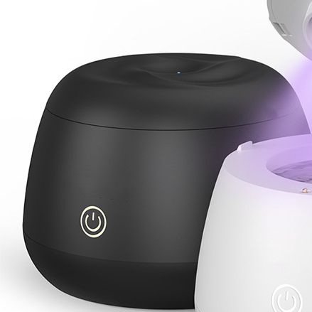 Black portable ultrasonic denture and jewelry cleaner