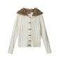 Cream white cable knit cardigan with wooden toggles and vegan fur trimmed hood, front view, size L