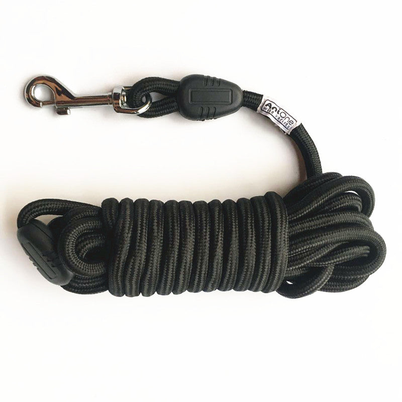 Coiled round nylon pet training leash showing the metal swivel clip and rope texture