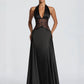 Black satin halter gown with a plunging V and sheer lace waist, front studio view