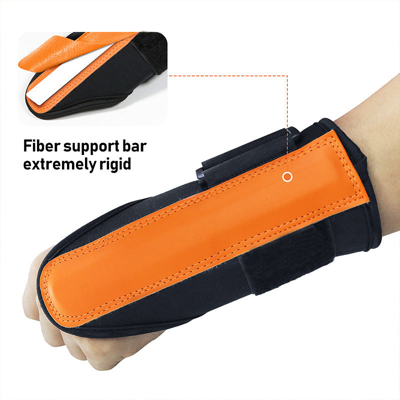 Close view of the orange leather panel and rigid support bar of the golf wrist support worn on the wrist