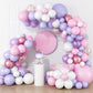 Assembled daisy balloon garland shown beside a chair for scale reference