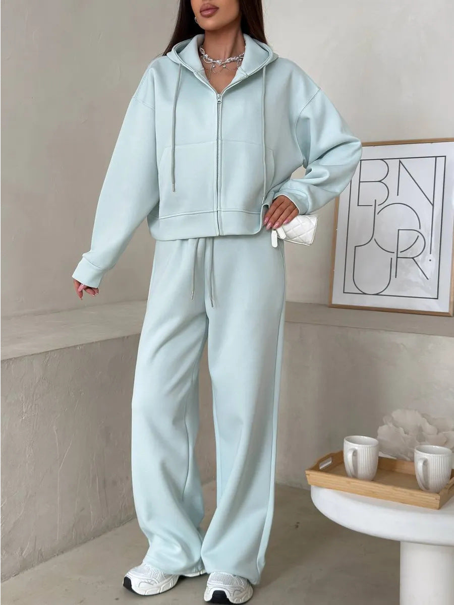 Pale aqua cyan zip front hooded sweatshirt and wide leg trousers set, Cyan color, worn by a model, the Size M option