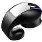 Close-up of a glossy black clip-on earphone with a green light rim and a mirrored panel