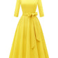 Side angle of the swing dress showing the bodice darts and full pleated A-line skirt