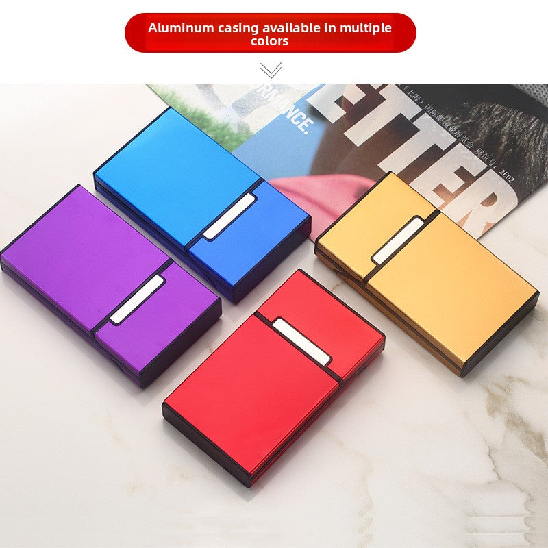 Aluminum cigarette cases in purple, blue, red, and gold finishes on a marble surface