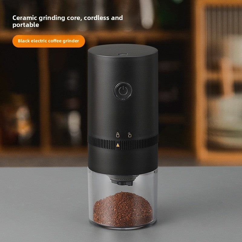 Black electric coffee grinder with a power button and ground coffee in a clear cup, ceramic grinding core text overlay