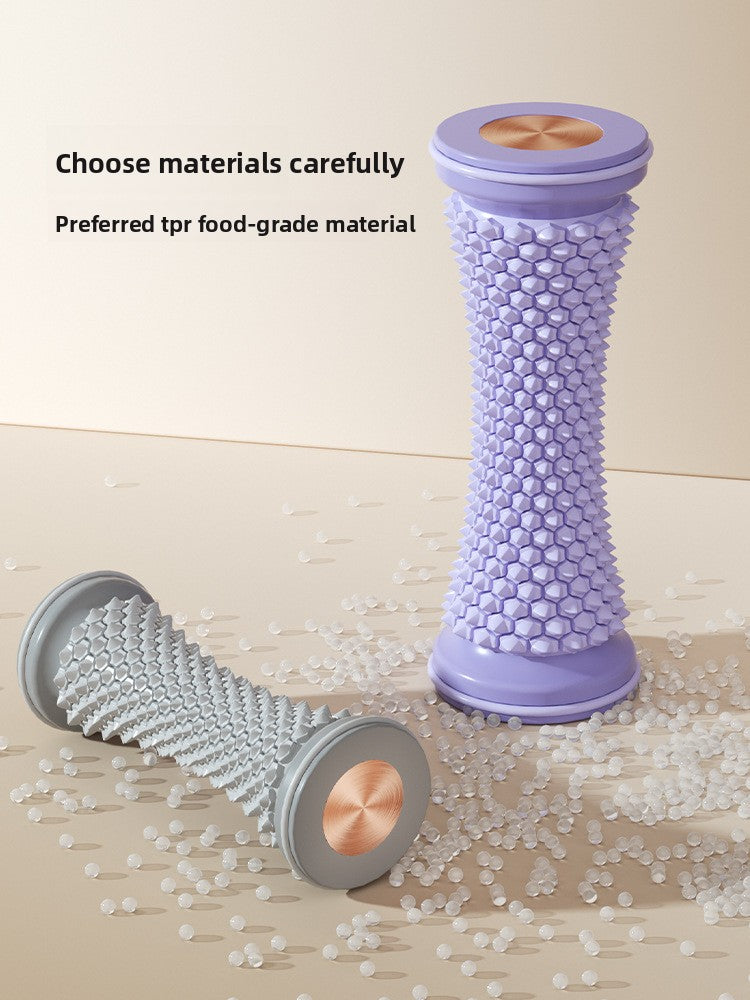 Foot massage roller shown beside a hand for a sense of its compact size