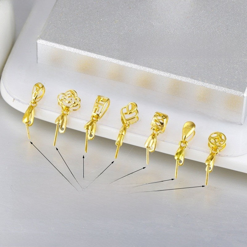 Gold-tone jewelry finding at an angle showing the metal tone