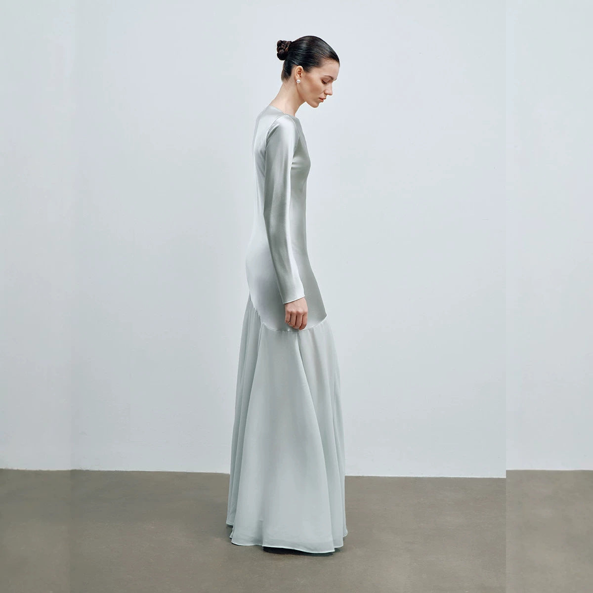 Close up of the soft mint satin fabric and sheen on the evening gown