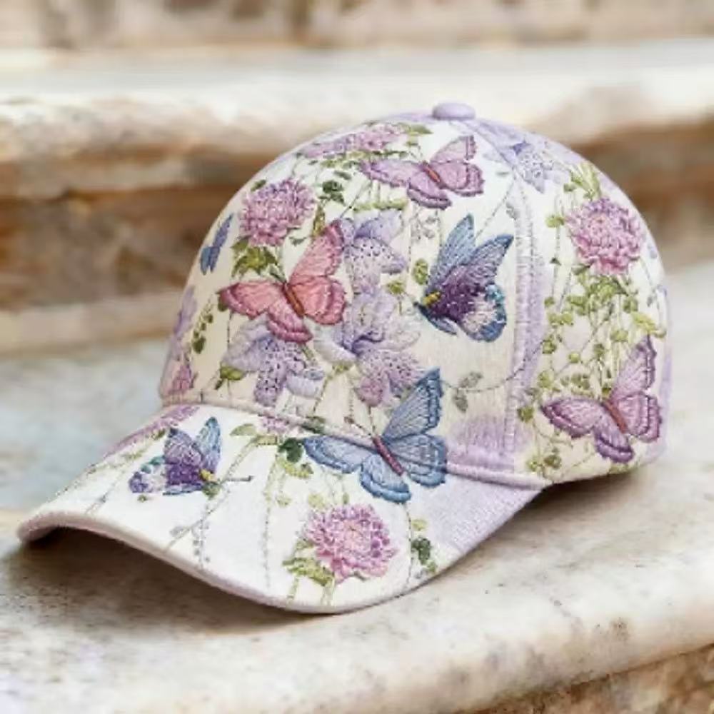 Six panel dome crown cap with a garden floral print across the front and sides