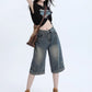 High-waist denim shorts laid flat, full top-down view