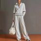 Full length view of the White two piece set, brown trim at the collar and ribbed cuffs