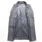 Gray wool blend coat laid open to show the smooth gray lining and the inside of the front