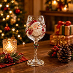 Clear stemmed Christmas wine goblet with a painted Santa design set in a festive room