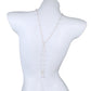 White bust form displaying the faux pearl lariat with a single Y strand dropping down the back
