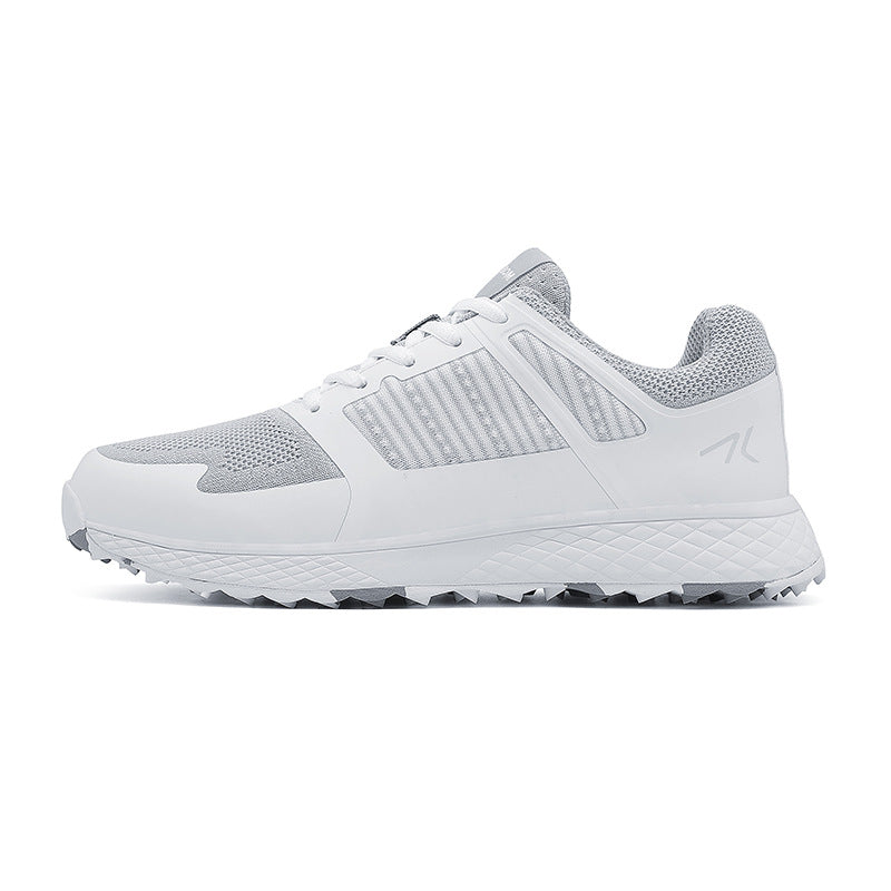 Mens golf shoe with mesh and synthetic upper on a white studio background
