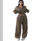 Model wearing the army green cropped half-zip sweatshirt and wide-leg sweatpants set, front view