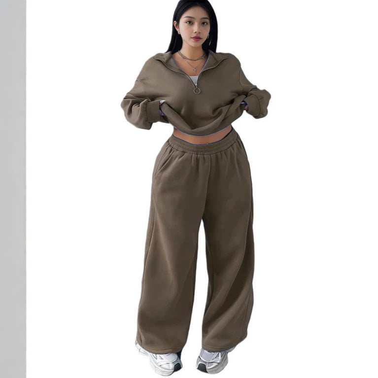 Model wearing the army green cropped half-zip sweatshirt and wide-leg sweatpants set, front view