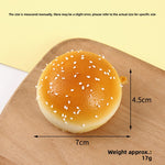 Slow rebound foam squishy bread toy held in hand for scale and feel