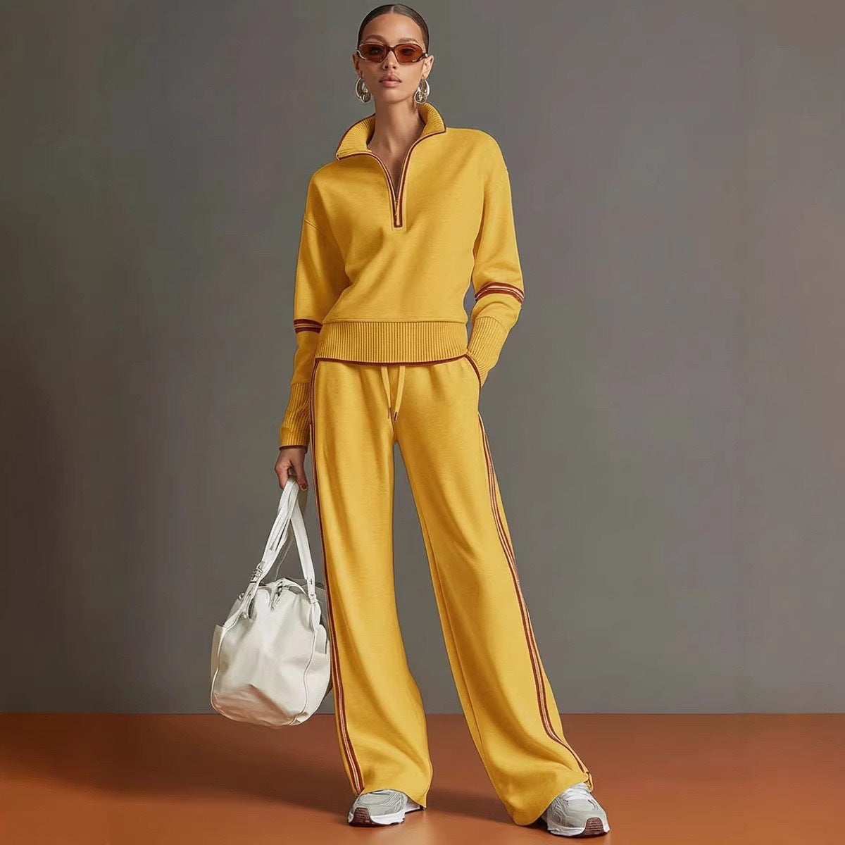 Yellow stand collar sweatshirt with rust contrast trim and matching wide leg drawstring pants