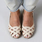 Womens woven peep toe flat sandal with a closed cupped heel and smooth super fiber insole