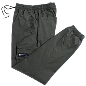 Camo cargo joggers laid flat showing thigh cargo pockets and a tapered elastic cuff leg