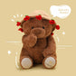 Child holding the plush teddy bear during quiet bedtime play at home