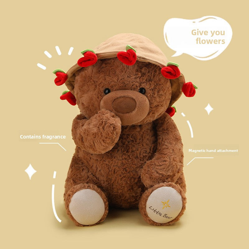 Child holding the plush teddy bear during quiet bedtime play at home