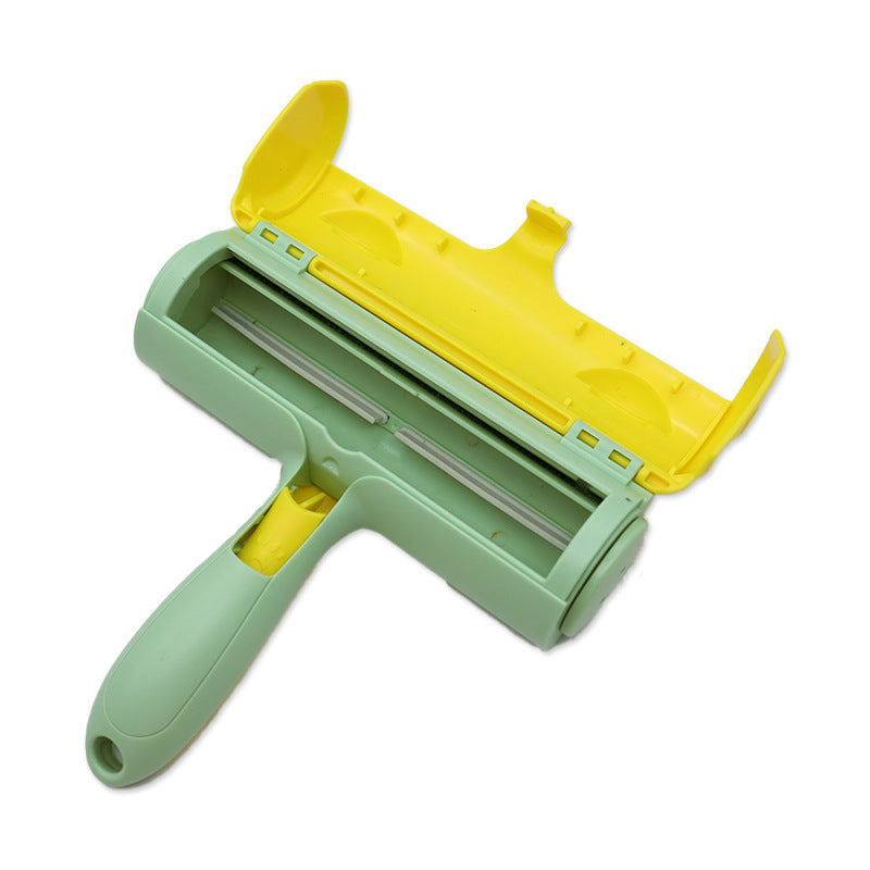 Pet hair roller with the yellow lid raised, showing the green cloth roller and the hair compartment inside