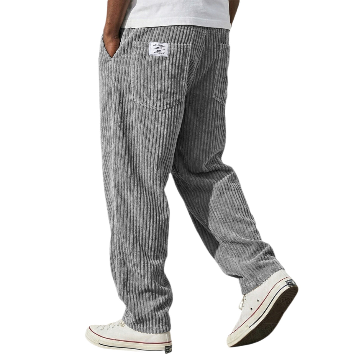 Corduroy trousers worn with a plain tee to show the relaxed straight leg cut
