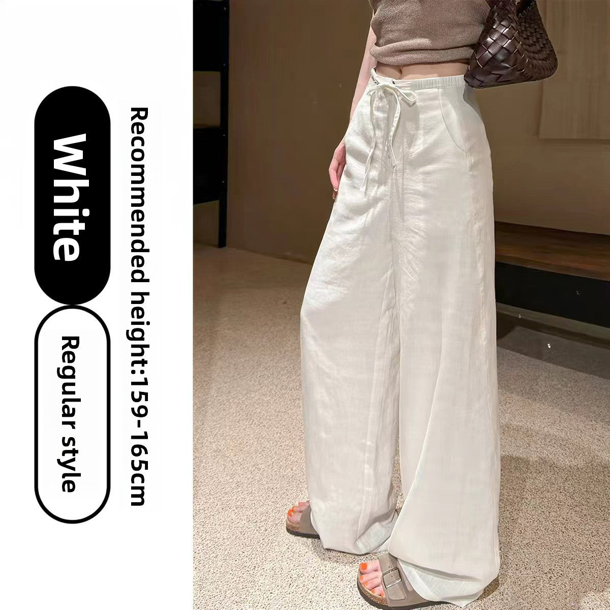Womens high waist wide leg linen blend drawstring trousers, close up of the drawstring high waist and tie bow
