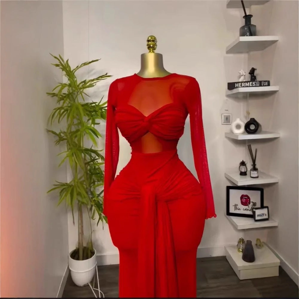 Red long sleeve maxi dress on a gold head mannequin showing the twisted bust and hip drape