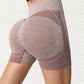 Side back view of the rosewood khaki shorts showing the curved seam and knit texture