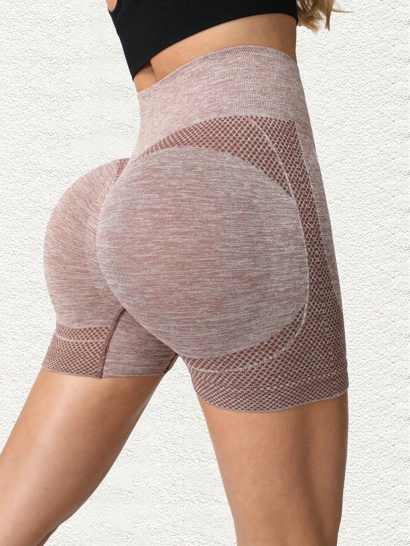 Side back view of the rosewood khaki shorts showing the curved seam and knit texture