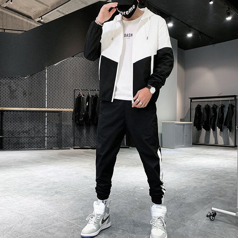 Close view of the tracksuit fabric and side stripe on the jacket sleeve