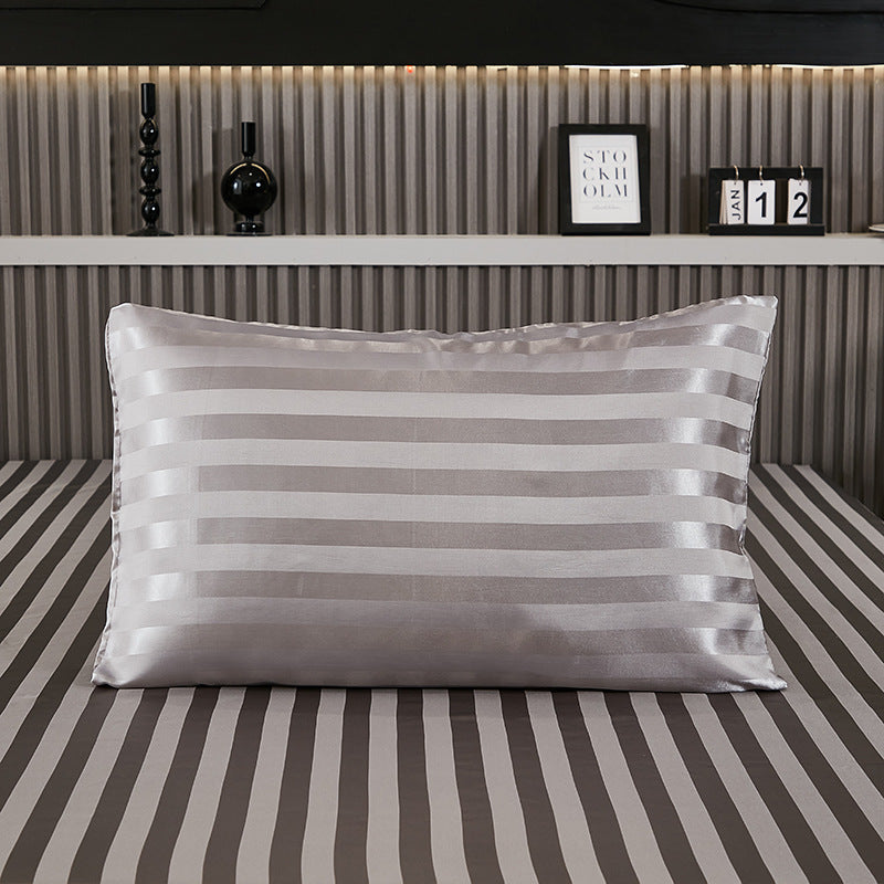 Full view of the satin pillowcase from the front on a bed