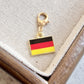 Germany enamel country flag keychain charm on a gold tone lobster clasp for keys and bags